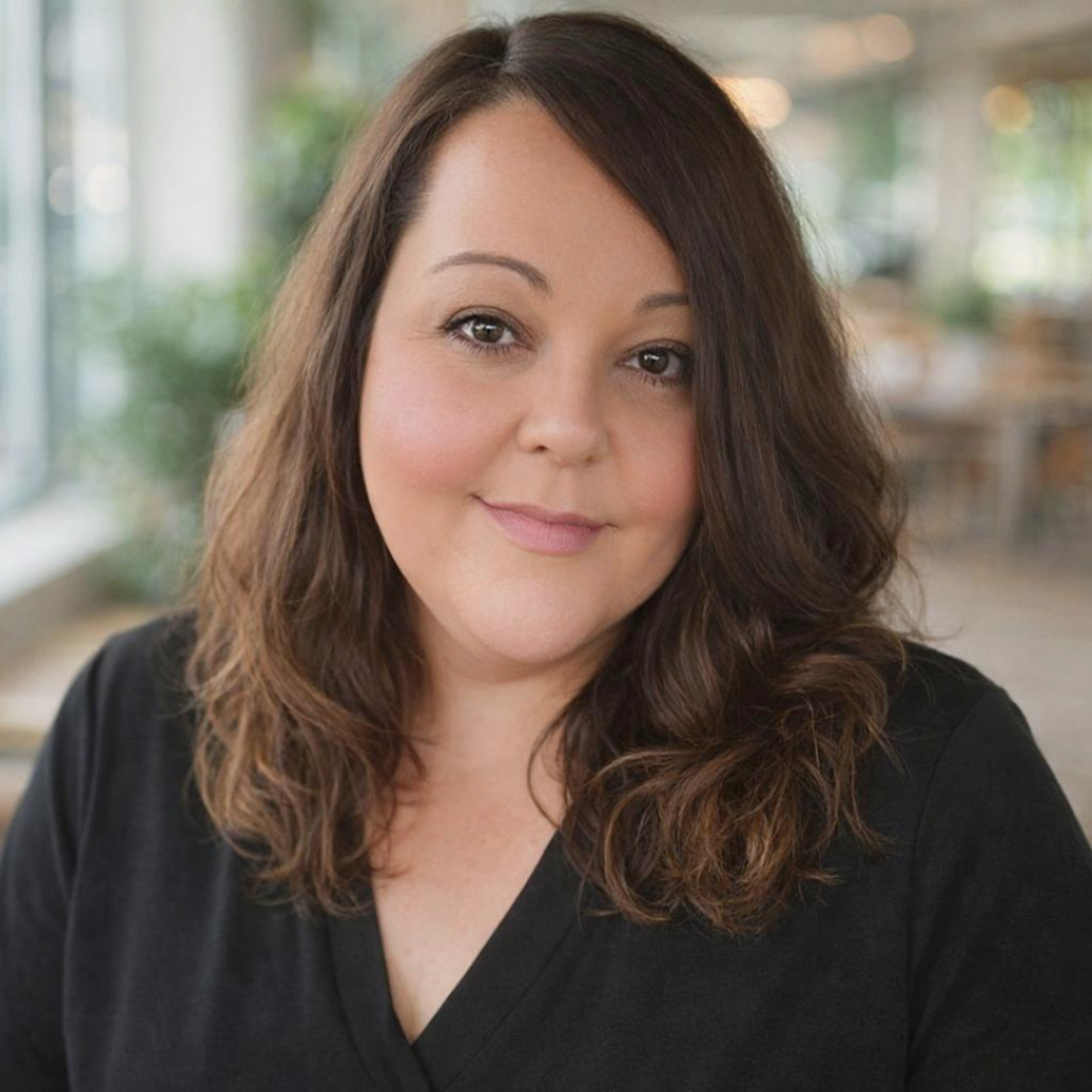 Picture of Chelsea Stephens.  Woman wearing a black top with brown hair.